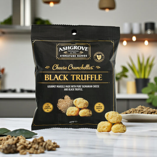 Packaging of Ashgrove Cheese Tasmania Black Truffle Cheese Crunchettes on a kitchen counter.