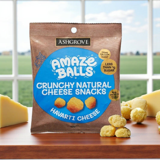 Packaging of Ashgrove Cheese Amaze Balls Crunchy Natural Cheese Snacks with cheese in the background
