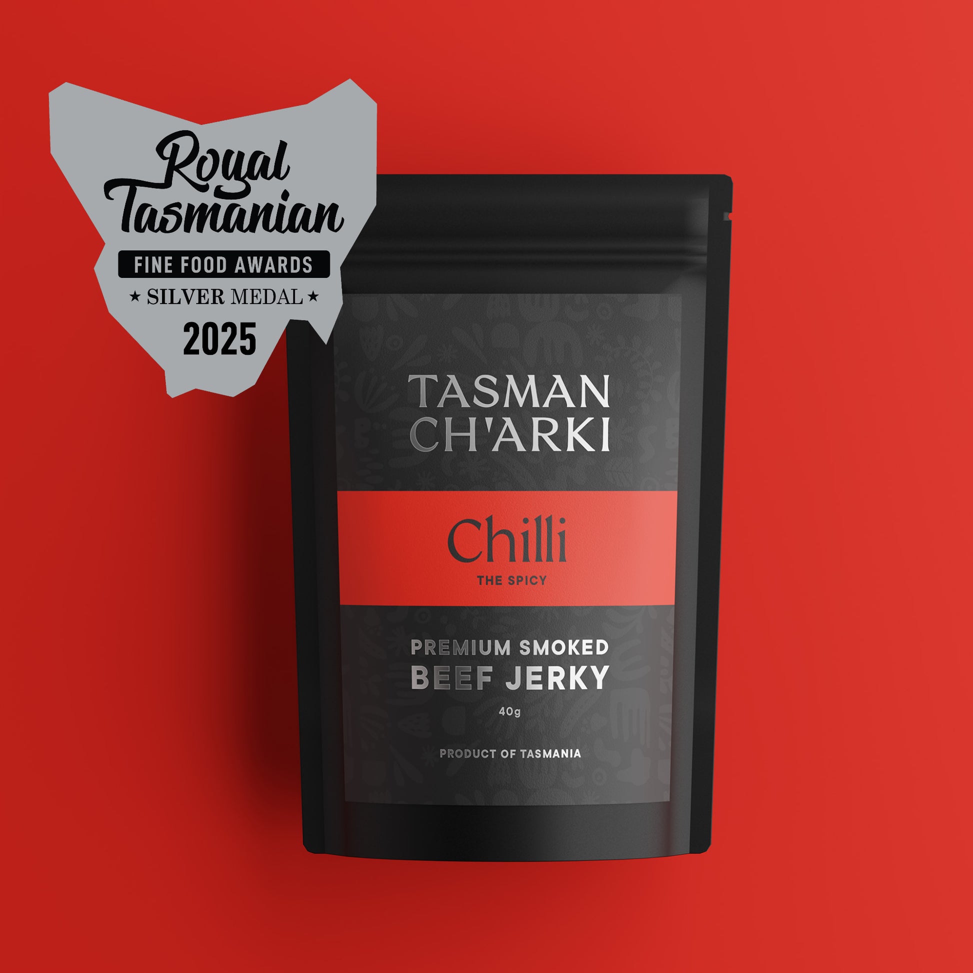 Tasmanian Tasman Ch'arki Chilli beef jerky package with a silver medal badge on a red background