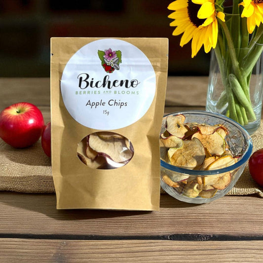 Bicheno Berries and Blooms Tasmanian apple chips packaging with a bowl of apple chips and apples on a wooden surface.