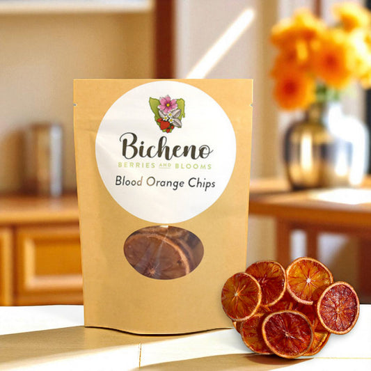 Packaged Tasmanian blood orange chips with Bicheno label on a blurred kitchen background