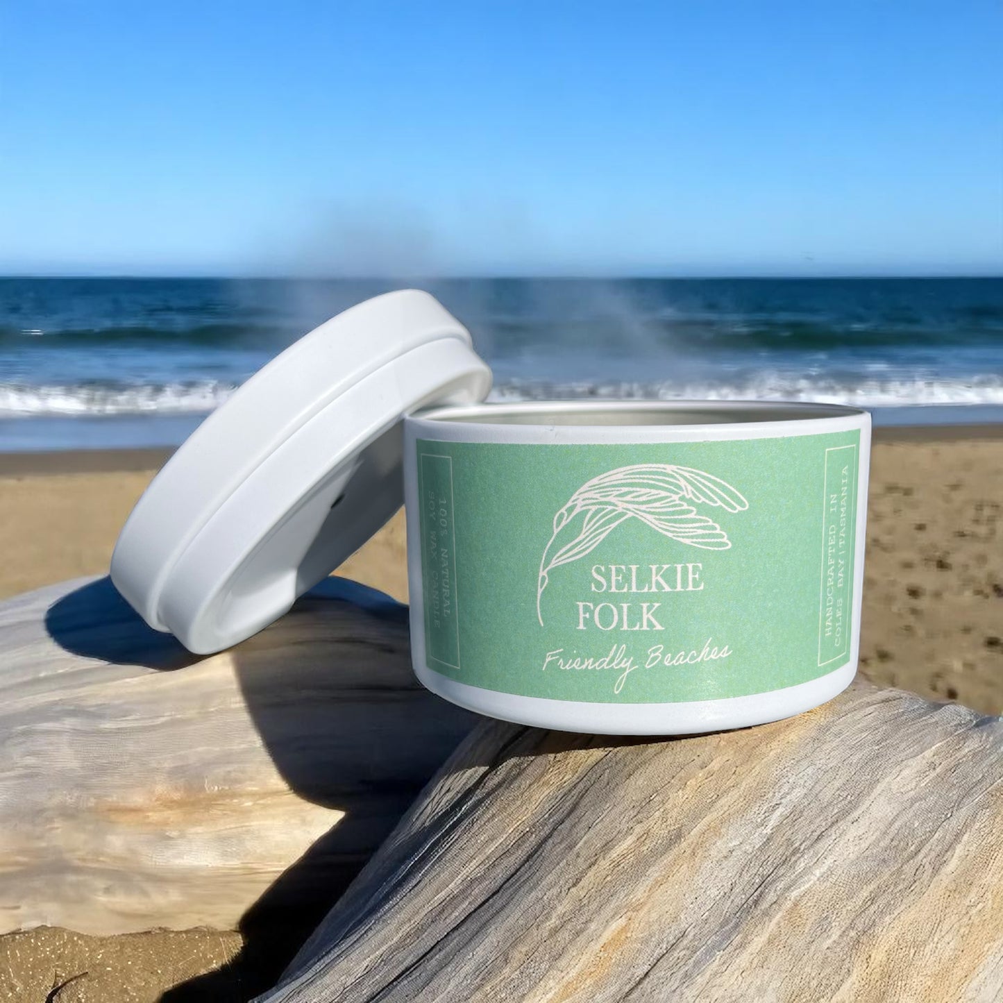 Close-up of Friendly Beaches soy candle lid featuring Selkie Folk branding and Tasmanian craftsmanship