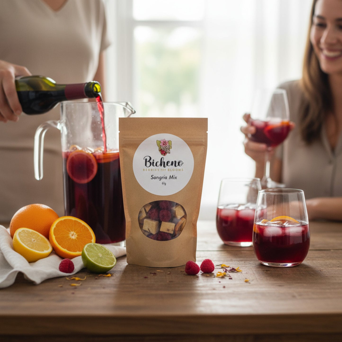 Person pouring red wine into a pitcher with a bag of Bicheno Berries and Blooms Tasmania Sangria Mix on a table.