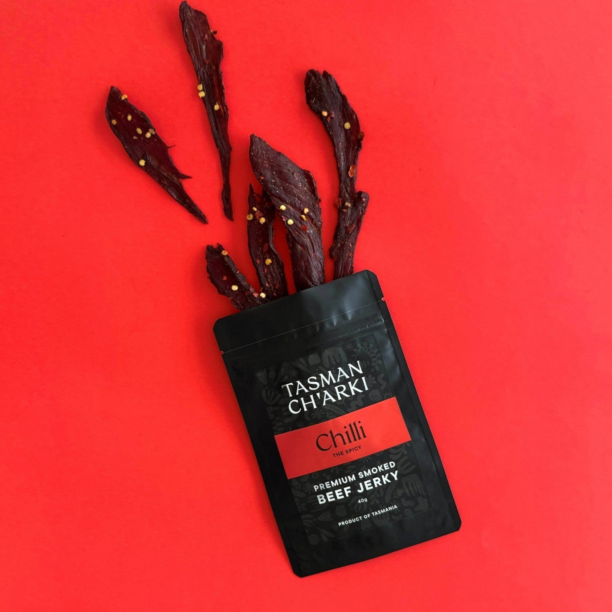 Spicy chilli beef jerky pieces displaying texture and colour of Tasmanian smoked jerky
