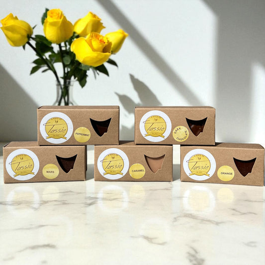 Handmade Tasmanian fudge variety pack showing five different flavours including caramel, dark chocolate, peppermint, orange and Mars caramel