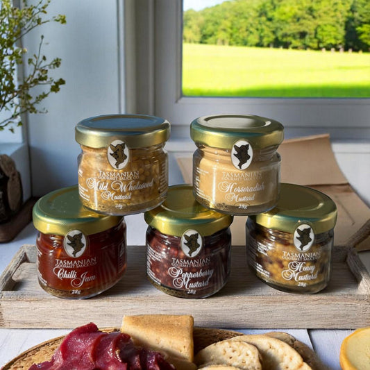 Tasmanian Gourmet Mustard Collection gift set showing five artisan mustard jars and chilli jam from Tasmanian Gourmet Sauce Company