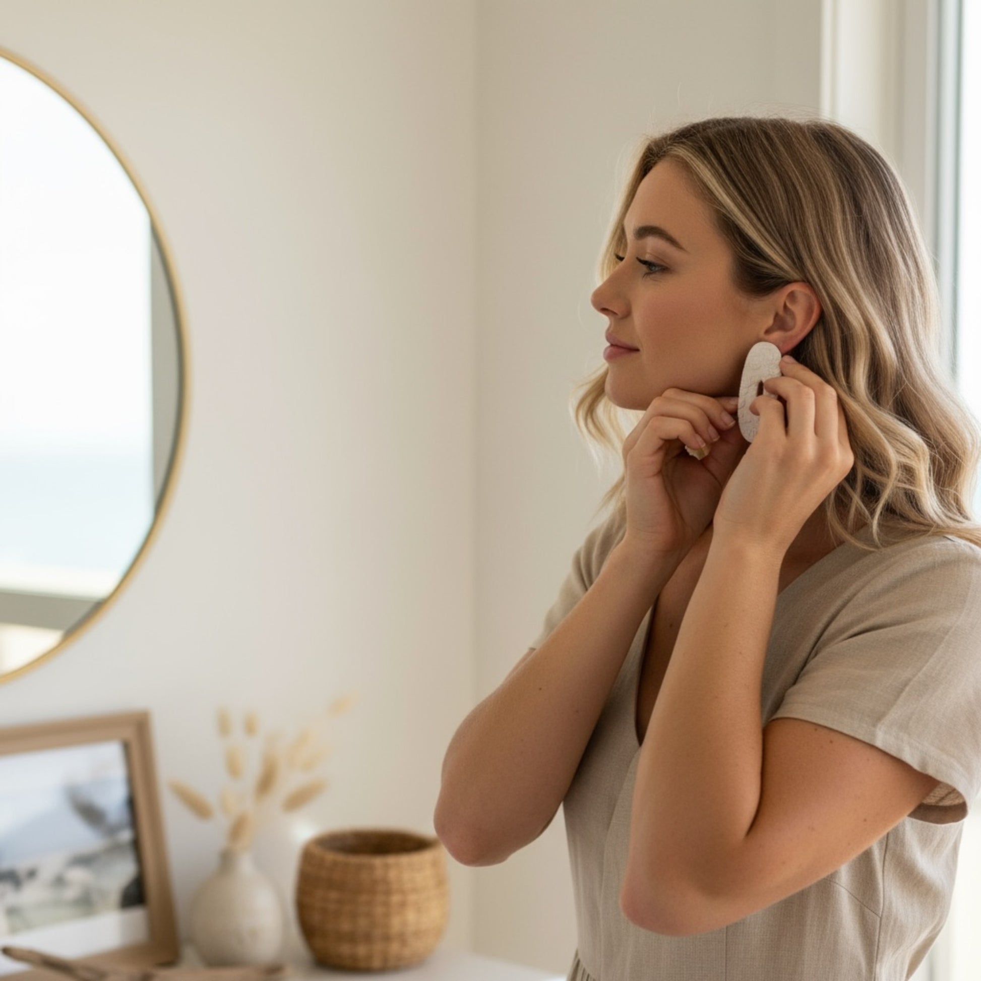 Woman wearing Moana large statement stud earrings showing size and coastal design by MarvLee Designs Tasmania