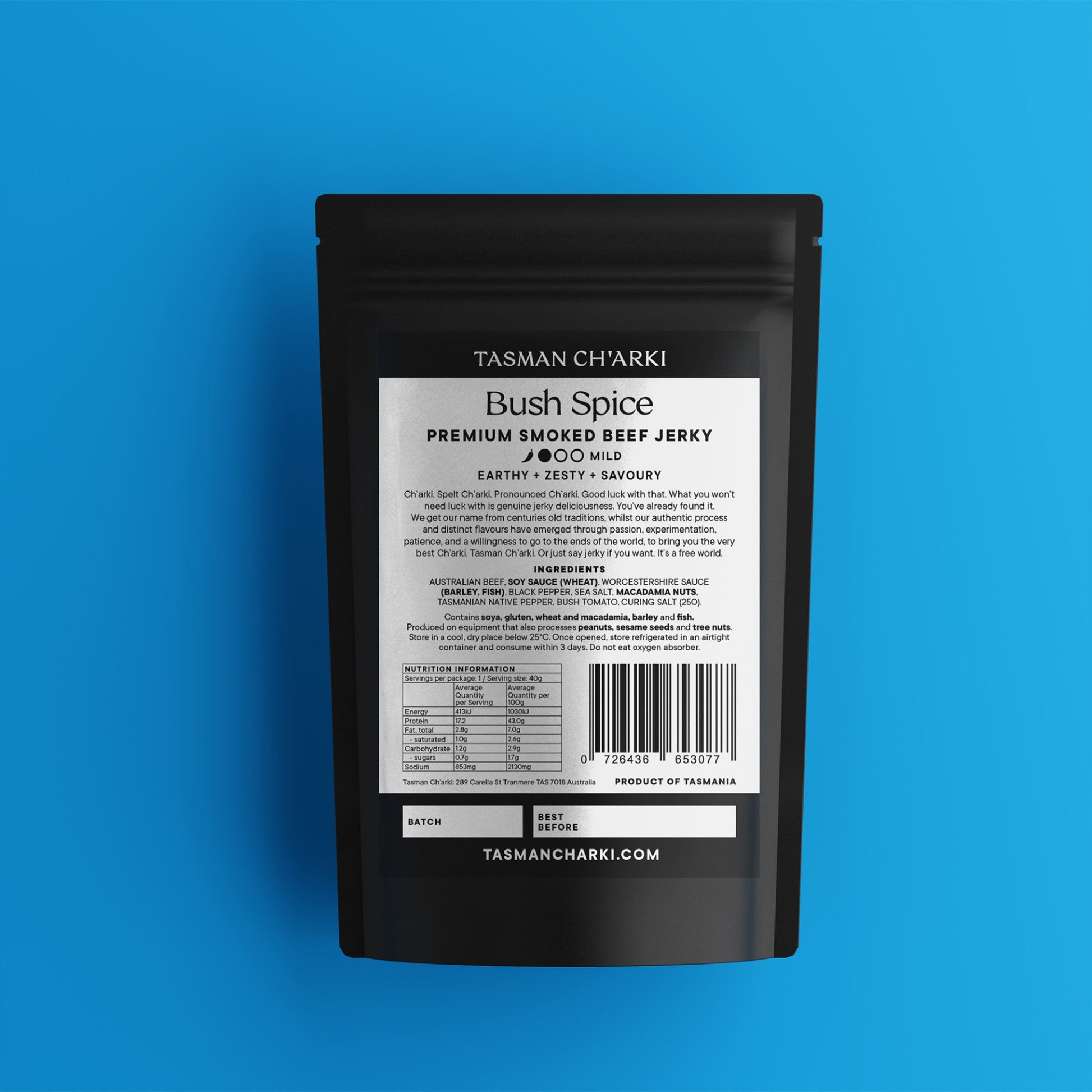 Black package of Tasman Ch'arki Tasmanian Bush Spice Premium Smoked Beef Jerky on a blue background