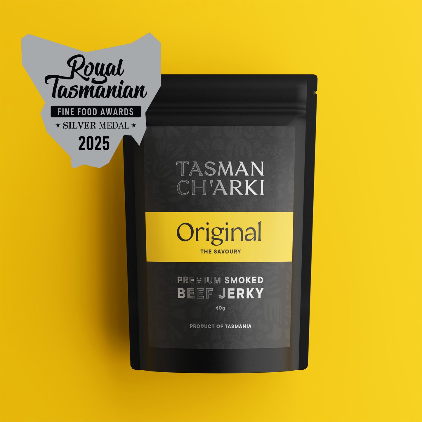Tasmanian Tasman Ch'arki beef jerky package with a silver medal badge on a yellow background