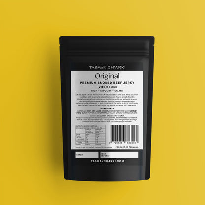 Black packaging of Tasman Ch'arki Tasmanian smoked beef jerky with a yellow background