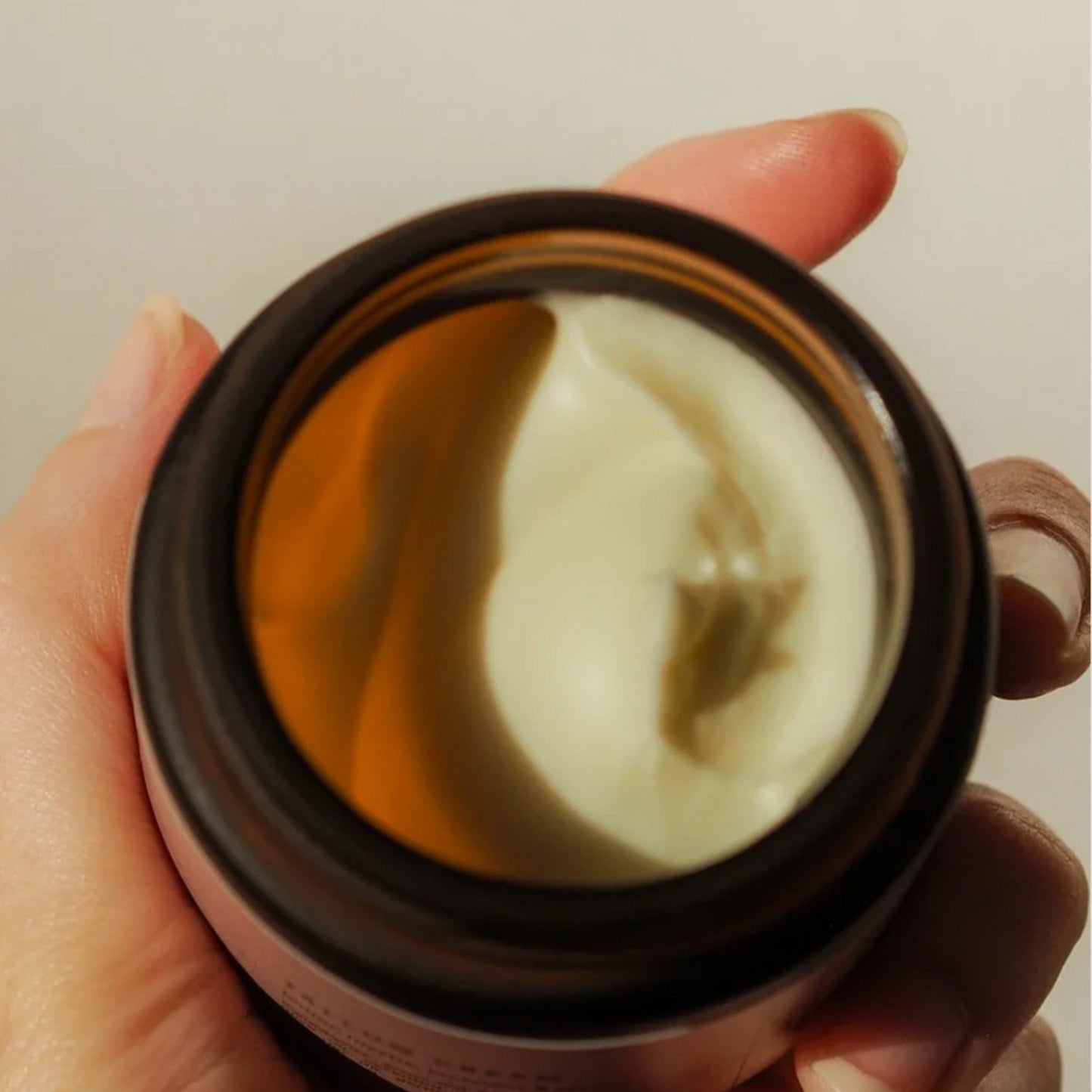 Close-up of lemon myrtle lavender geranium tallow cream texture showing smooth consistency