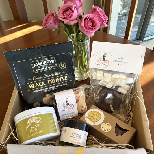 Tasmanian Pamper Box with handmade fudge, nougat, truffle cheese, rose tallow cream, scented candle, and hot chocolate kit