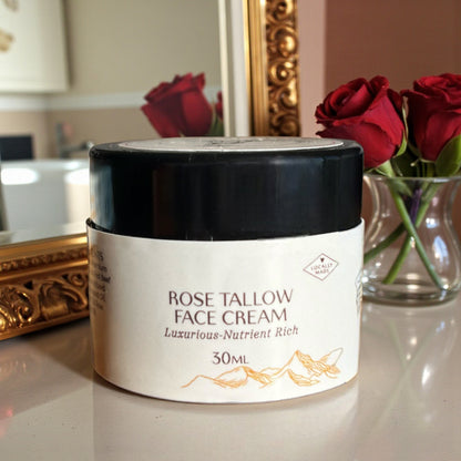 Tasmanian Valley Tallow Rose Face Cream jar surrounded by fresh roses